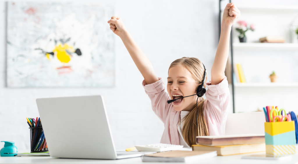 Learner cheers at laptop