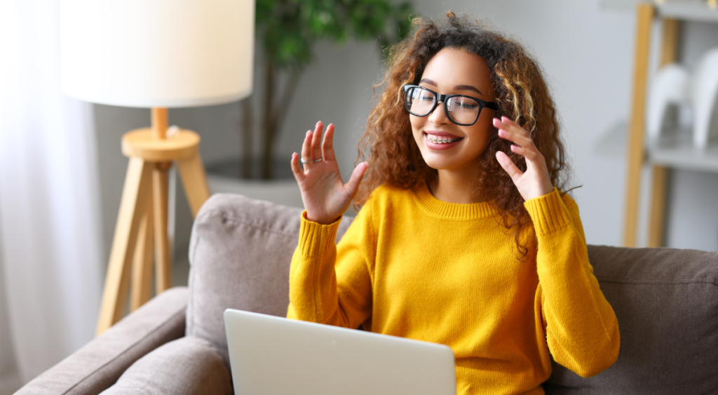 Teen learner tells a story with her laptop on her lap